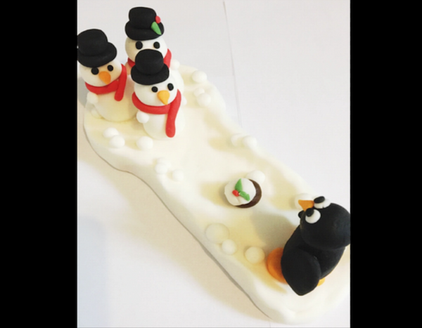 Edible bowling penguin cake topper