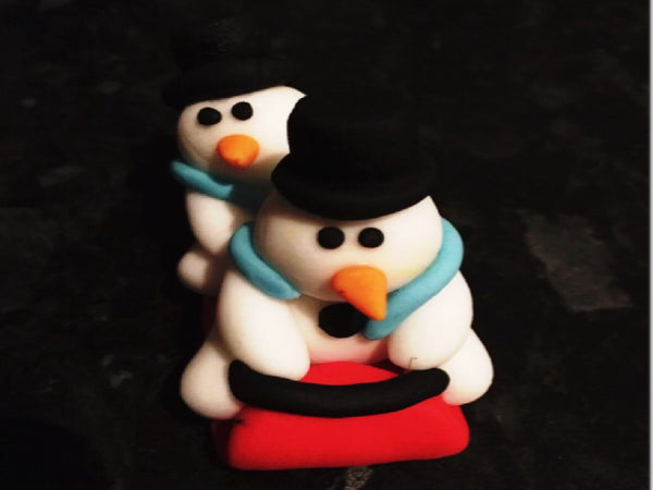 Edible snowmen on sleigh cake topper decoration