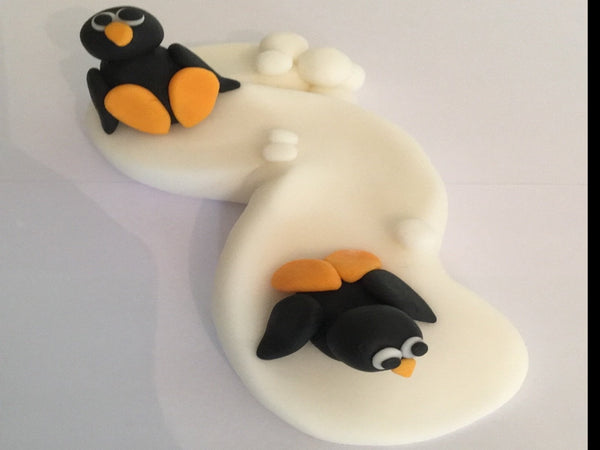 Edible penguin slope cake topper