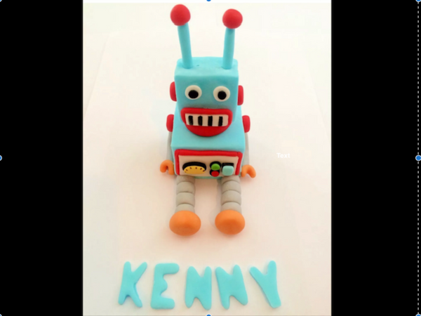 Premium AI Image | A robot on a cake with a sign that says'robot '